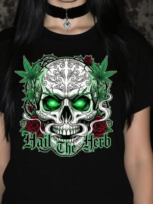 Gothic illustration of a detailed skull with electric green glowing eyes, surrounded by cannabis leaves and red roses on a black background. Gothic font text below reads: Hail The Herb. High-quality PNG for digital printing and merchandise.